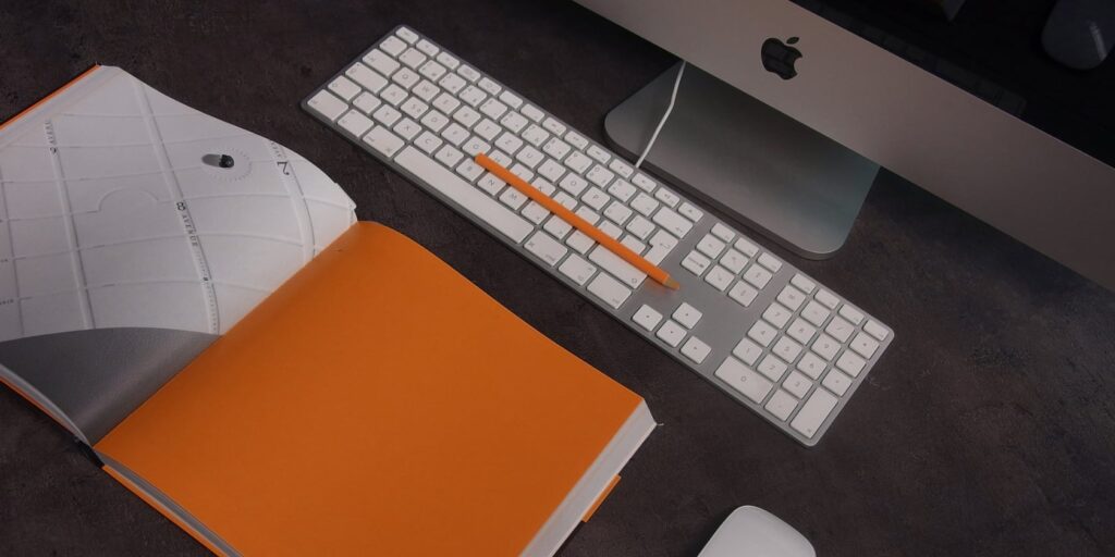 How to Make Any File a Template on MacOS 9 Orange journel in front of iMac