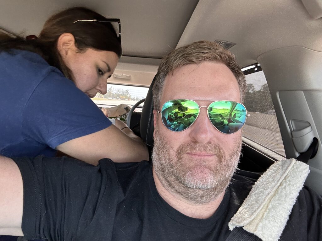 Pink Eye, Road Trips, Birthdays, and Thanks! 5 A young woman and man in a car