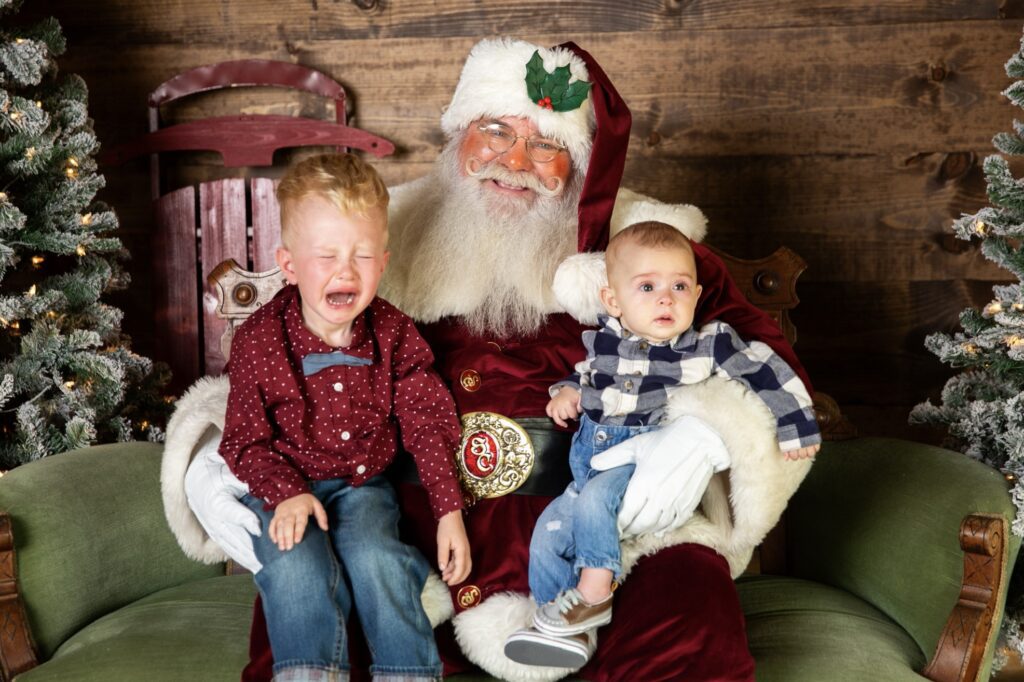 Pink Eye, Road Trips, Birthdays, and Thanks! 4 two young boys with pinkeye not liking Santa