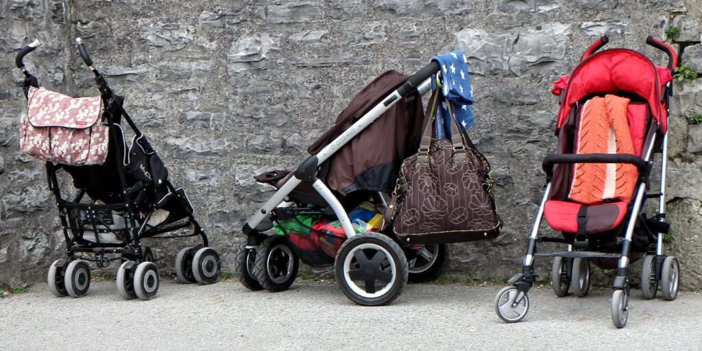 Avoiding the Oops - Time for a Vasectomy 5 three strollers facing different directions by a stone wall