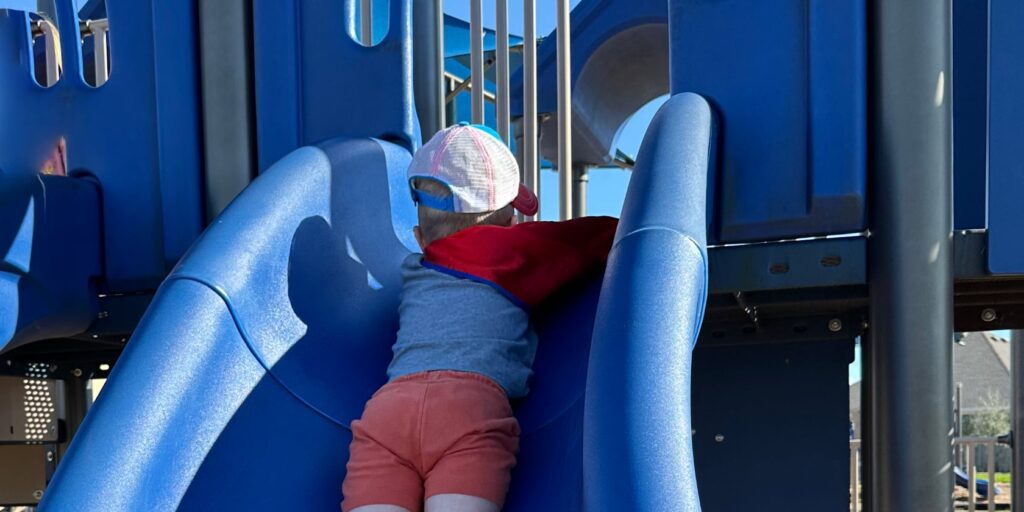 One of the Hardest Things I Do as a Dad Is Let My Son Struggle 9 A boy falling down the slide