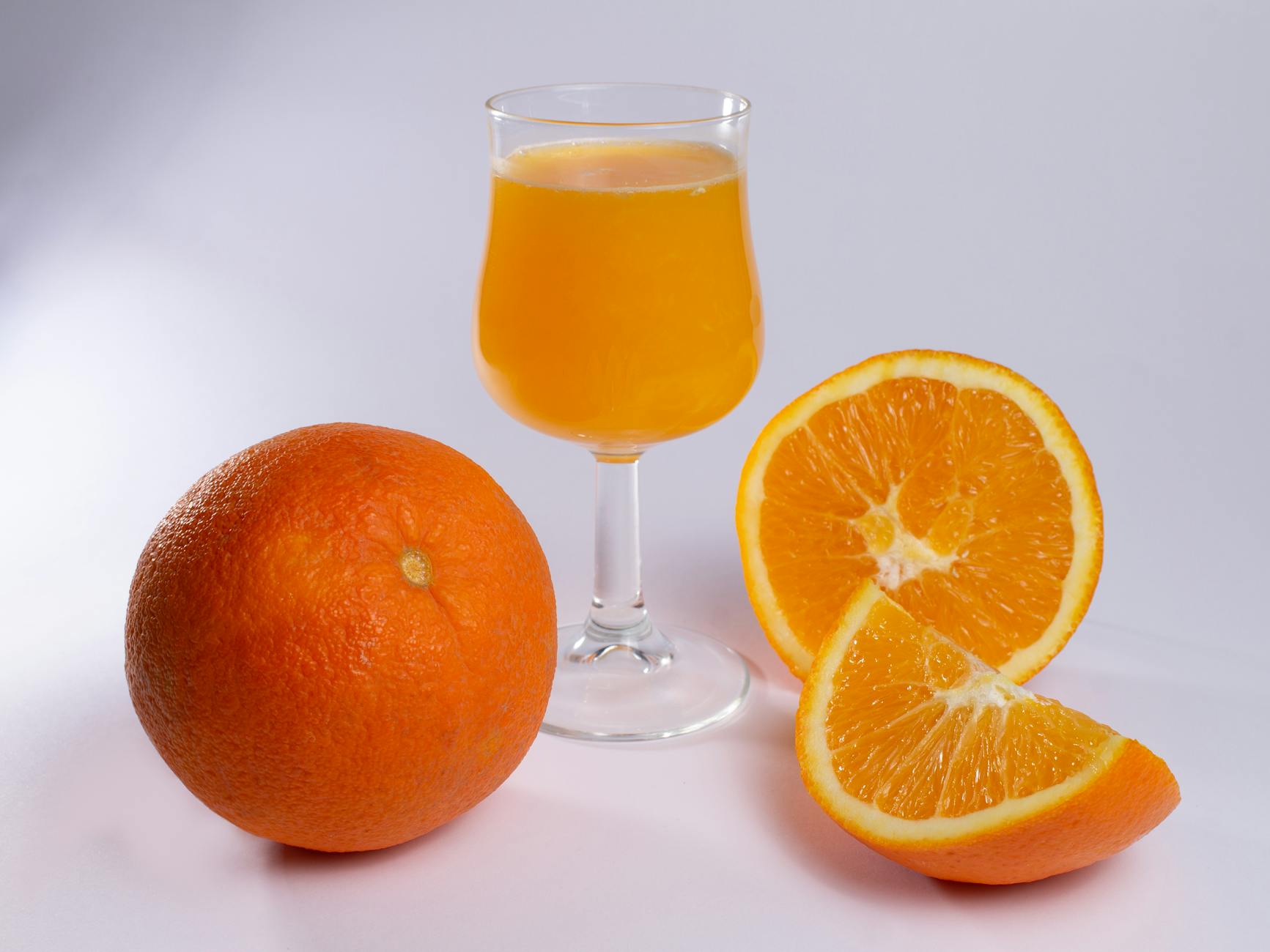 Recovery - My Vasectomy 1 Week Later Check-In 3 close up of fresh orange juice in a glass and oranges lying on white surface