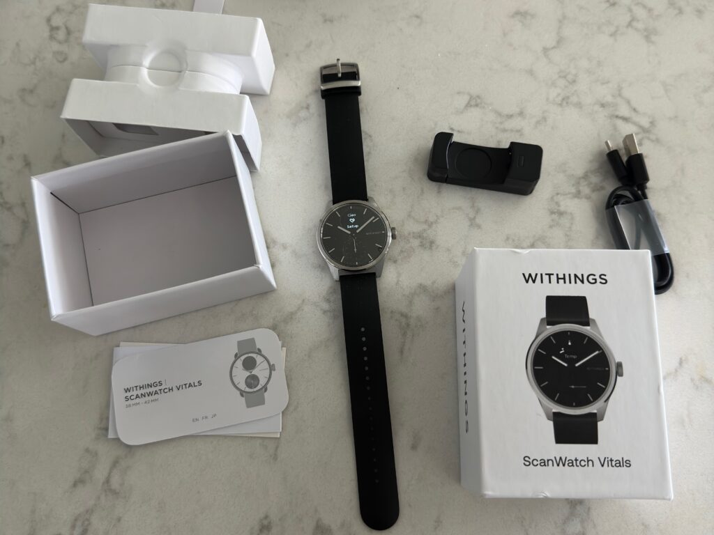 Withings ScanWatch Vitals: A Potential Competitor to the Apple Watch 4 ScanWatch Vitals box opened with watch, charger and instructions laid out