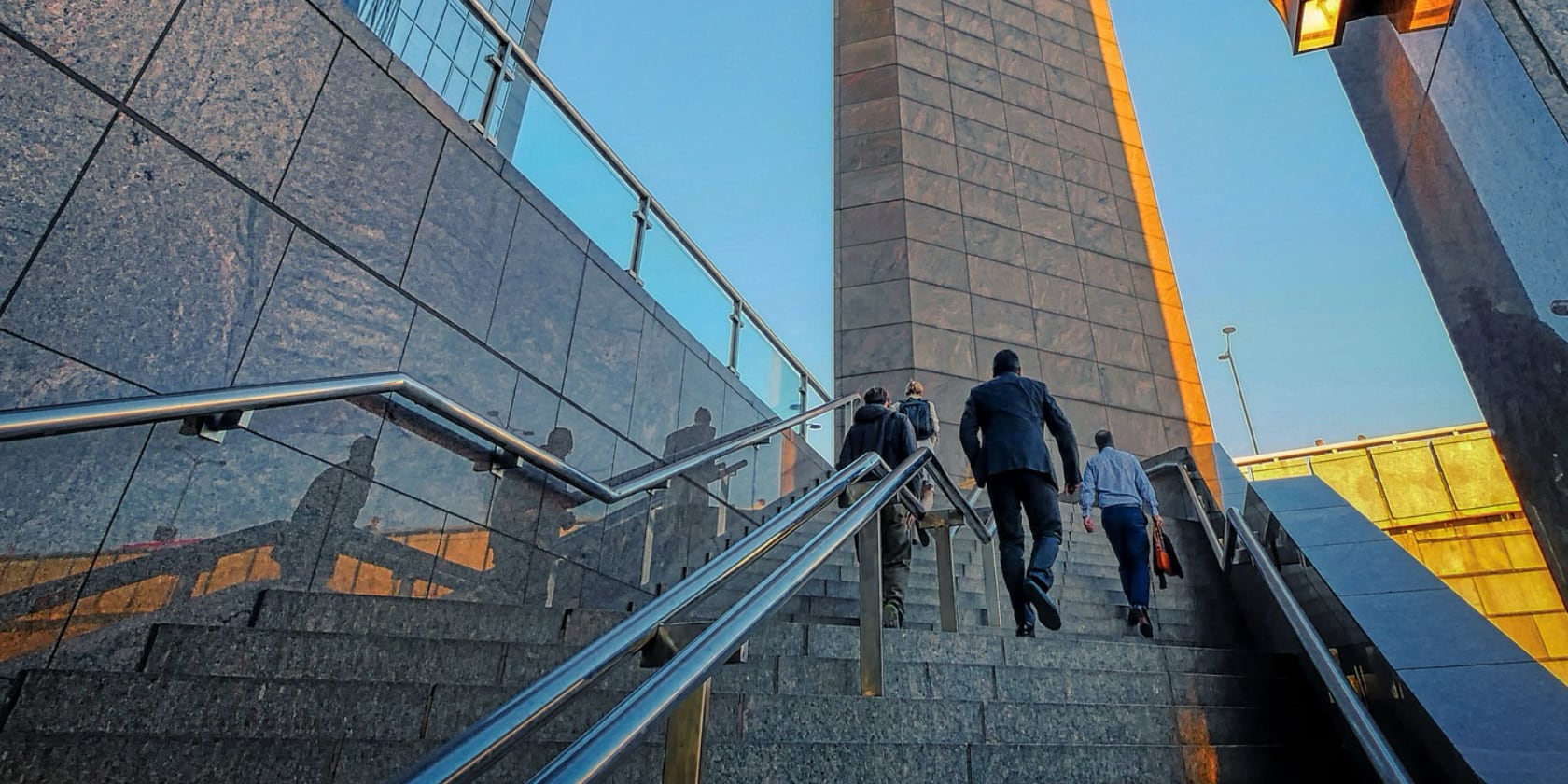 Business men climbing up the stairs