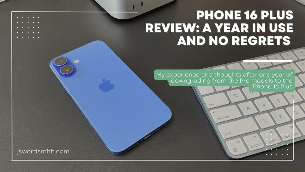 iPhone 16 Plus Review: A Year in Use and No Regrets 1 A blue iPhone 16 Plus lies on a black desk next to an Apple keyboard and Mac mini. Overlaid text reads: “Phone 16 Plus Review: A Year in Use and No Regrets. My experience and thoughts after one year of downgrading from the Pro models to the iPhone 16 Plus.” The jswordsmith.com URL appears in the corner.