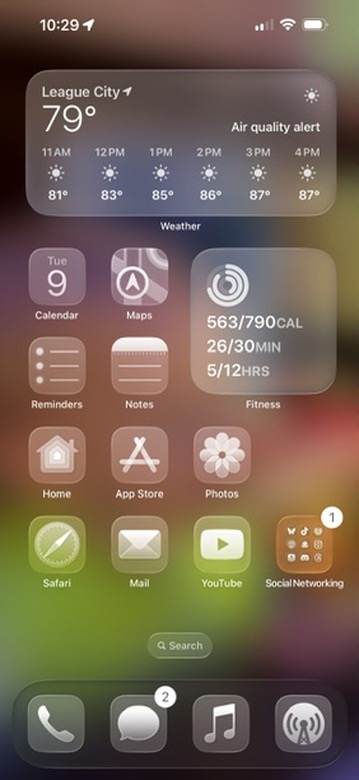 iOS 26 - Thoughts on Using the Best New Changes For iPhone and iPad 4 iPhone home screen with frosted glass icons and widgets on iOS 26
