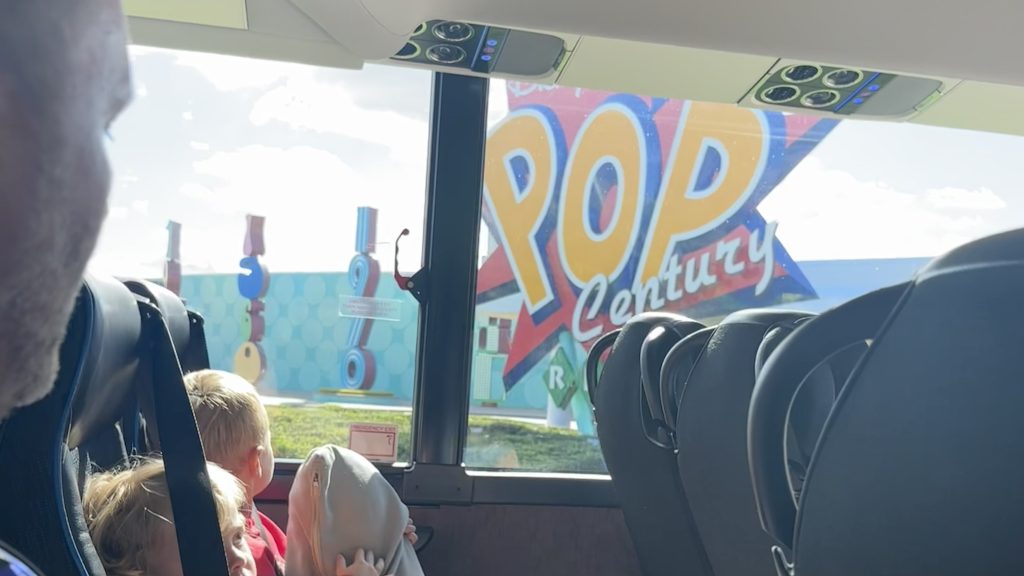 Conquering Disney World— My First Visit in Almost 40 Years 4 The Pop Century logo out a bus window