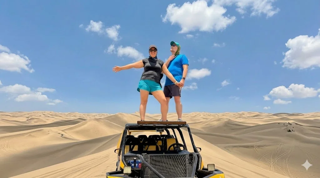 Standing on top of a dune buggy in the Huacachina desert, Peru