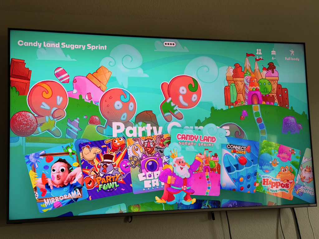 NEX Video game menu screen with candy theme and characters.
