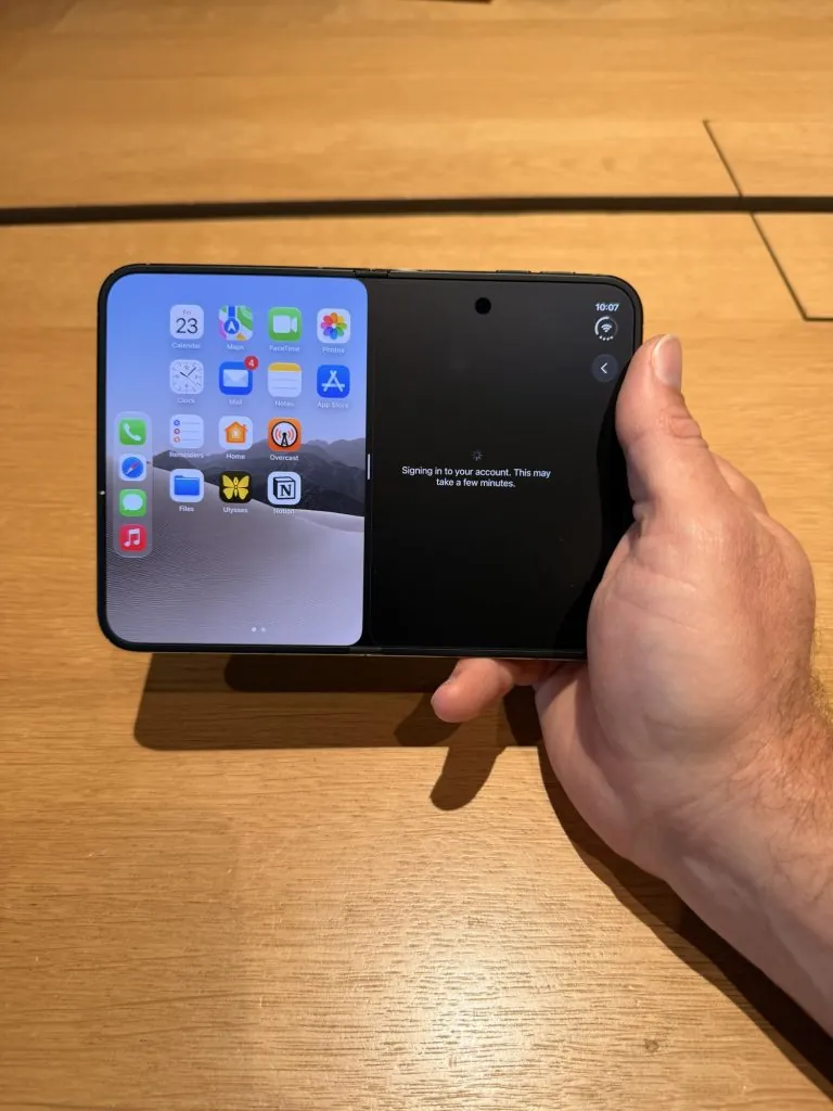 First iPhone Duo Impressions: Pick Up and Setup 4 the iPhone Duo running two apps at once being held by a hand